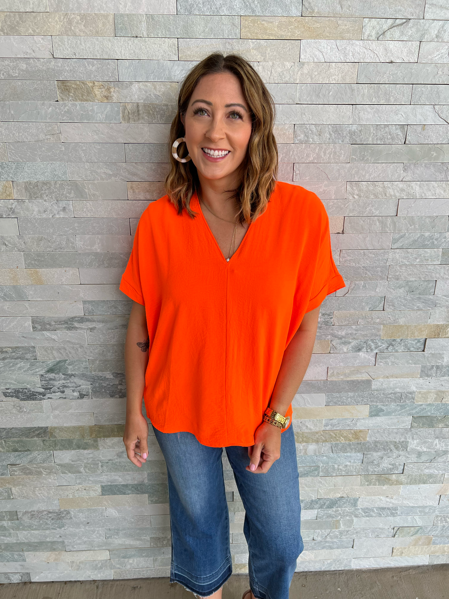 . Wear It Well Neon Orange V Neck Top